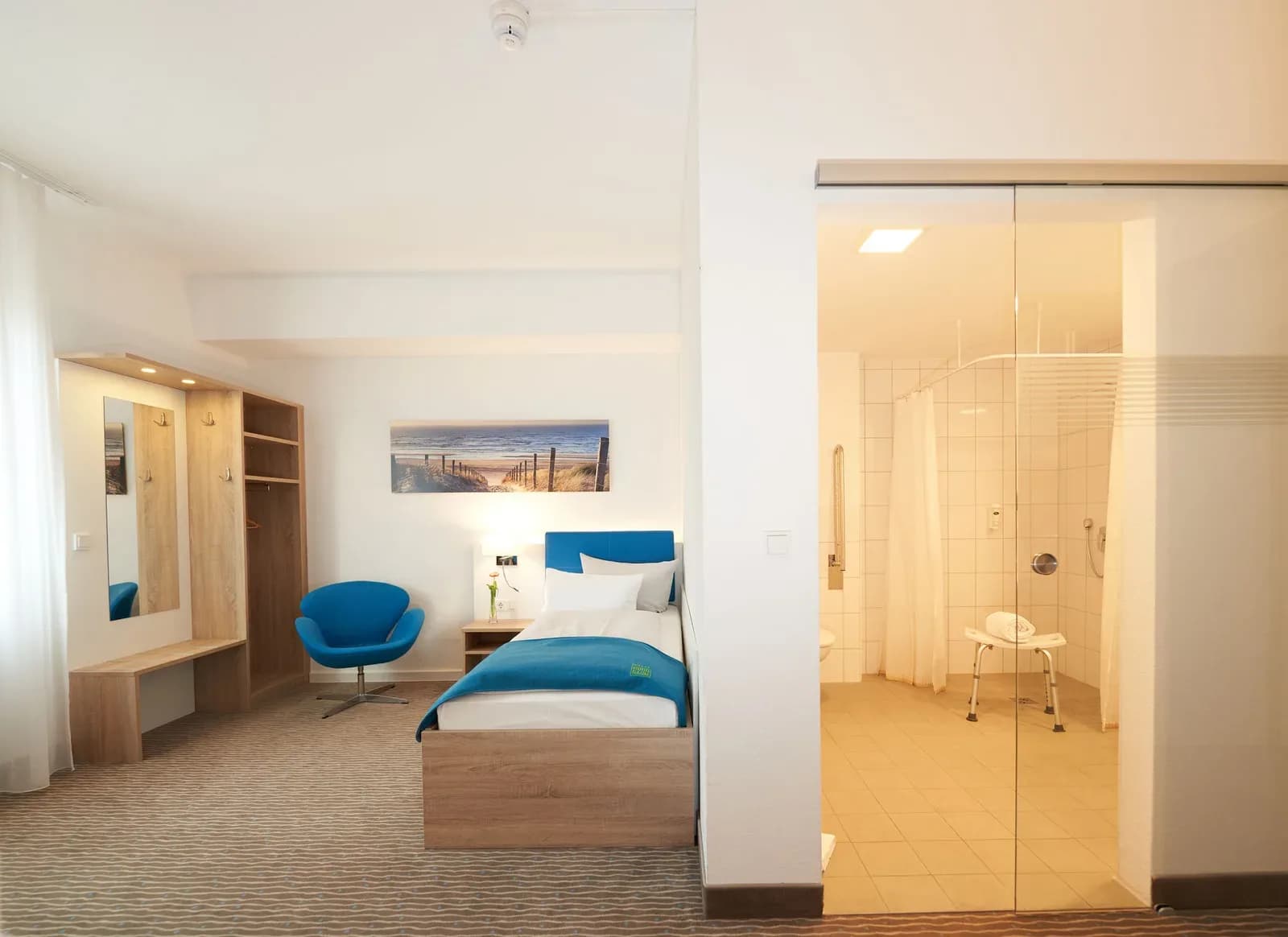 Accessible room with walk-in shower, shower stool and grab rail
